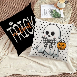 Detail of Halloween pillow covers featuring cartoon ghost and Trick or Treat typography