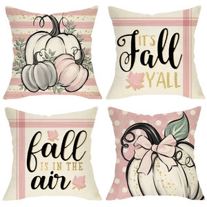 Set of four autumn linen pillow covers with pumpkin patterns and fall theme typography