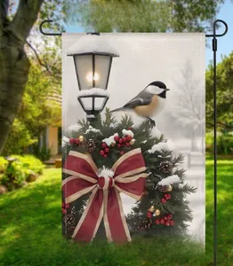 Outdoor Christmas garden flag with winter chickadee and holiday wreath on a metal pole