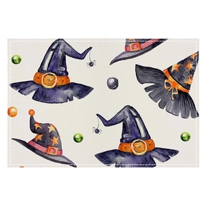 Halloween linen placemat with watercolor pumpkin and wizard hat design on beige fabric