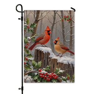 Winter garden flag featuring red cardinals on a snowy stump with a black metal stand