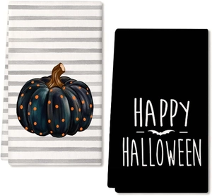 Dettagli degli asciugamani di Halloween con un design a zucca a pois e testo Happy Halloween