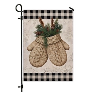 Detail of Christmas garden flag with winter knit gloves, pine cones and buffalo plaid borders