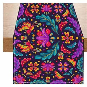 Detail of Mexican Otomi style table runner with colorful floral bird print on purple fabric