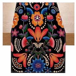 Close-up detail of Halloween floral table runner featuring vibrant patterns on black fabric