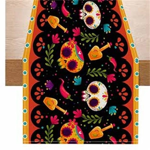 Detail of Day of the Dead table runner featuring colorful sugar skulls and floral patterns