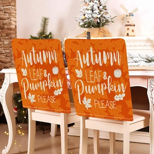 Set of two orange linen chair covers with white pumpkin and autumn leaf festive prints