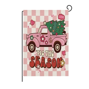 Close-up of pink checkered garden flag with vintage truck and 'Tis the Season' text