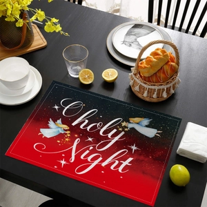 Detailed view of O Holy Night Christmas placemat with angel design on dark wooden table