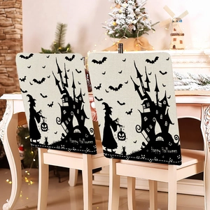 Detail view of two Halloween chair covers with spooky castle and witch silhouettes