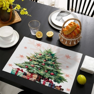 Detailed close-up of a Christmas placemat with hand-painted tree on a dark wooden table