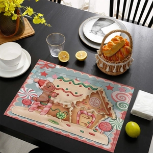 Detail of Christmas placemat with gingerbread house pattern on a wooden table setting