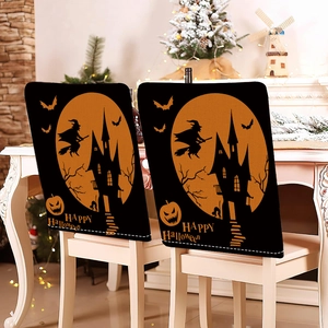 Two Halloween chair covers with witch and pumpkin designs on white wooden chairs