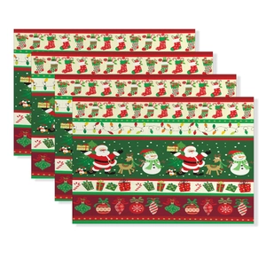 Set of four Christmas table mats with Santa, reindeer, and snowman festive patterns