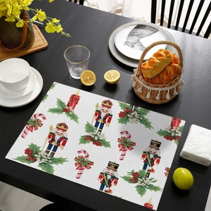 Detail of a Christmas nutcracker table mat with high-quality stitching on dark wood surface