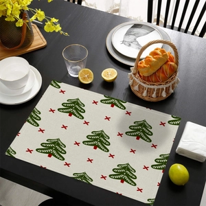 Christmas tree print heat-resistant table mat on dark wood table for holiday dining decoration