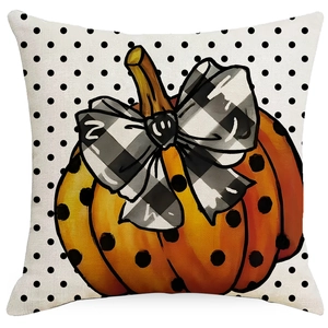 Halloween pumpkin throw pillow cover with polka dots and black white bow on linen fabric