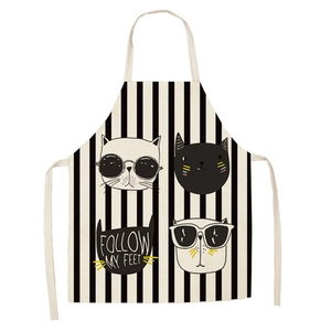 Detailed close-up of cartoon cat prints on a striped linen sleeveless kitchen apron