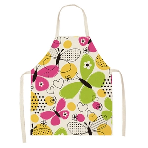 Close-up of sleeveless apron fabric showing colorful cartoon butterflies and dots