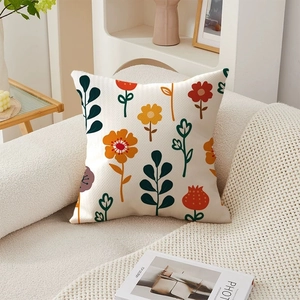 Detailed texture of American floral throw pillow on a white sofa in a cozy room