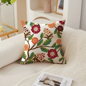 Floral textured throw pillow cover on a white sofa in a cozy living room setting