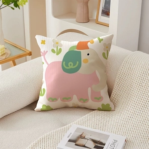 Detail shot of square throw pillow with textured 3D floral elephant pattern