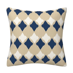 Detail of navy blue geometric diamond pattern and woven linen texture on sofa cushion cover