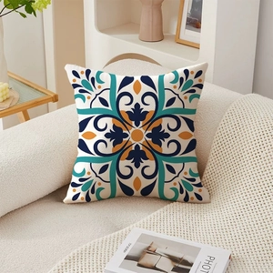 Bohemian floral pattern square throw pillow cover on a beige fabric sofa for home decor