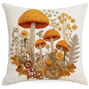 Close-up of 3D mushroom embroidery texture on linen pillowcase with warm floral patterns