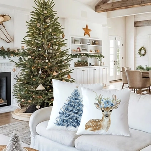 Christmas pillow covers with blue snowflake and reindeer patterns in watercolor style