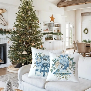 Detailed blue watercolor floral and bell prints on white square Christmas pillowcases