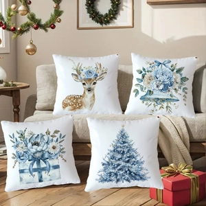 Close-up of blue reindeer and Christmas tree prints on white square decorative pillowcases