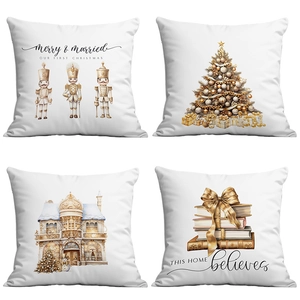 Detail view of four Christmas pillow covers with Nutcracker and gold festive prints