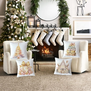 Detail of four Christmas pillow covers with watercolor holiday prints in a cozy home setting