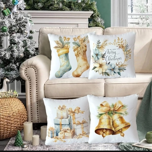 Detail of four Christmas pillow covers with watercolor Santa and gift prints on sofa