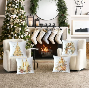 Set of four Christmas pillow covers with festive snowman and candle illustrations on a sofa