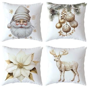 Set of four Christmas pillow covers with gold Santa and reindeer prints on white fabric