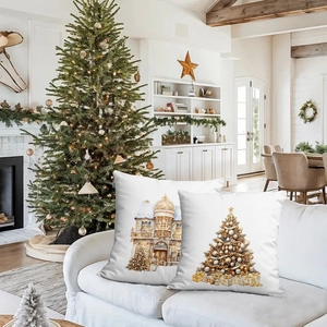 Detail of Christmas pillow covers featuring a festive tree and snowy architecture