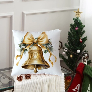 Detailed close-up of Christmas pillow cover with golden bells and silk bow design