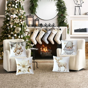 Close-up of four festive Christmas pillow covers with Santa and reindeer on a sofa