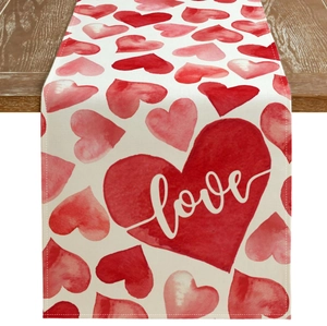 Romantic Valentine's Day table runner featuring red watercolor hearts and love script design