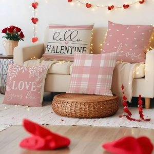 Cozy home decor showing four Valentine's Day linen pillow covers on a soft sofa