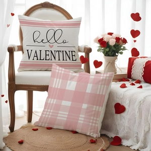 Linen Valentine pillow cover featuring pink stripes and hello VALENTINE text on wood chair