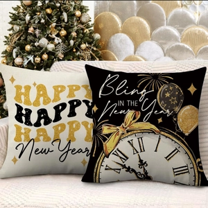 Close-up of Happy New Year pillow covers featuring gold clock and festive fireworks pattern