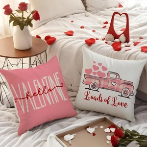 Valentine's Day pillow covers with heart truck design on a bed with rose petals