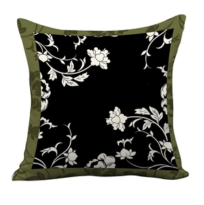 Detail of vintage square pillowcase with green floral border and black floral center pattern