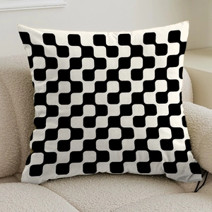 Close-up of square cushion with black and white geometric wave pattern on beige sofa