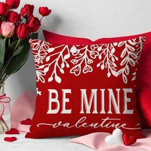 Red Valentine's Day cushion cover with Be Mine text and white floral heart design