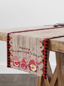 Detail of Valentine's Day gnome table runner with wood grain and red roses pattern