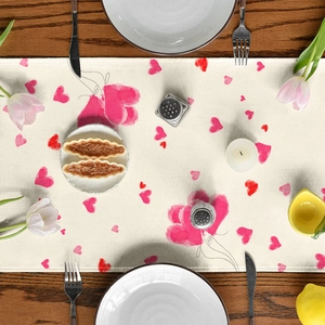 Valentine's Day table runner with pink watercolor hearts on rustic wooden table